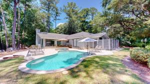 a house with a swimming pool in the yard at 79 Port Tack in Hilton Head Island