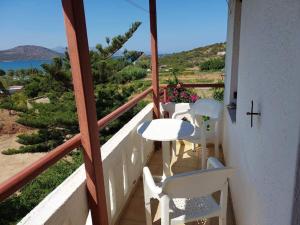 a balcony with a table and chairs and the ocean at Victoria2 in Istro