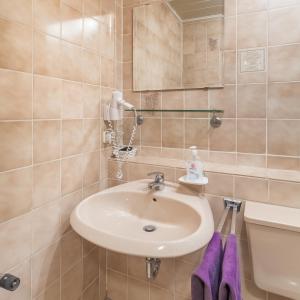 a bathroom with a sink and a toilet at Gasthof Alte Post in Falkendorf +25 photos