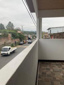 a view of a street from the balcony of a house at Vacacional Abril in Juayúa +1 photo