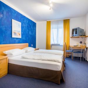 Postel nebo postele na pokoji v ubytování Gasthof Alte Post + 25 fotografií