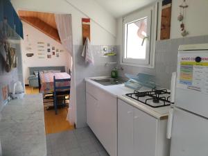 A kitchen or kitchenette at Verde Mare Aptm - Rooftop Terrace - near sea- A.C. Még 24 kép