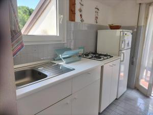 A kitchen or kitchenette at Verde Mare Aptm - Rooftop Terrace - near sea- A.C.