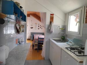 A kitchen or kitchenette at Verde Mare Aptm - Rooftop Terrace - near sea- A.C.