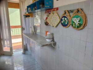 A kitchen or kitchenette at Verde Mare Aptm - Rooftop Terrace - near sea- A.C.