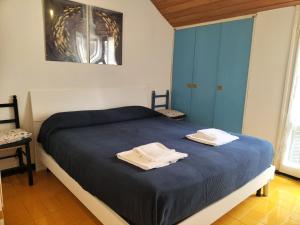 A bed or beds in a room at Verde Mare Aptm - Rooftop Terrace - near sea- A.C.