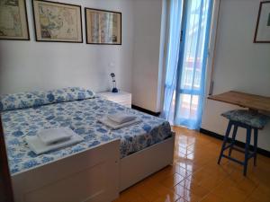 A bed or beds in a room at Verde Mare Aptm - Rooftop Terrace - near sea- A.C.