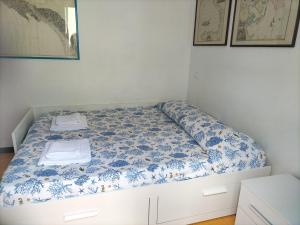 A bed or beds in a room at Verde Mare Aptm - Rooftop Terrace - near sea- A.C.