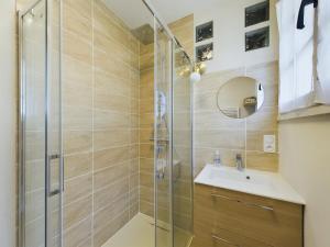 a bathroom with a shower and a sink at -AZEL- Maison surplombant l ocean in Névez +16 photos