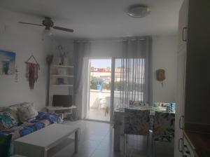 A seating area at Mi morena cala llobeta 35