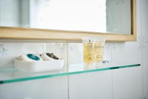 a glass counter top in a bathroom with a mirror at Dunluce Park 6 - Portrush by the Sea in Portrush +63 photos