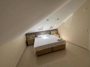 a bedroom with a bed in a attic at Belek Golf Village - Villa with private pool in Belek +46 photos
