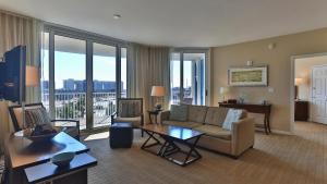 a living room with a couch and a table at Palms of Destin 2517 Luxury in the heart of Destin!!! in Destin