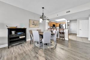 a dining room and kitchen with a table and chairs at Ariel Dunes I Unit 1209 Gulf view in Destin