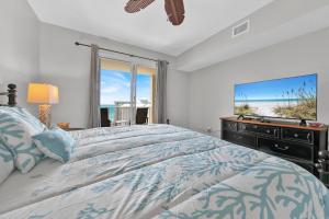 a bedroom with a large bed and a large window at Ariel Dunes I Unit 1209 Gulf view in Destin +35 photos