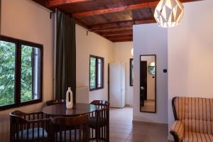 a kitchen and dining room with a table and chairs at Villa Concordia in Budva