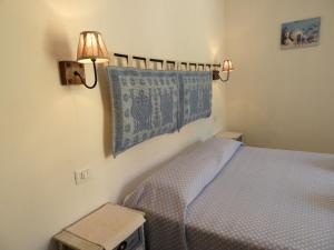Postel nebo postele na pokoji v ubytování S'apposenteddu Affittacamere del Ristorante da Stefano