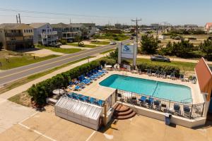 an overhead view of a swimming pool at a resort at Dolphin Oceanfront Motel - Nags Head in Nags Head