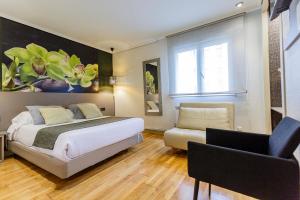 Posteľ alebo postele v izbe v ubytovaní Hostal Rodas Pamplona