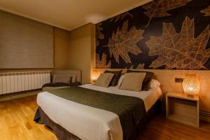 Posteľ alebo postele v izbe v ubytovaní Hostal Rodas Pamplona