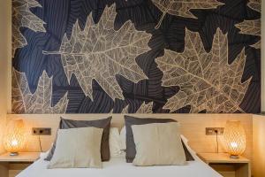Posteľ alebo postele v izbe v ubytovaní Hostal Rodas Pamplona