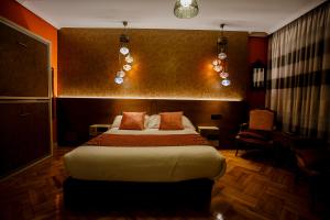 Posteľ alebo postele v izbe v ubytovaní Hostal Rodas Pamplona