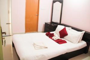 a bedroom with a bed with a large mirror at Grand Selim Resort & Tour – GSRT in Sreemangal