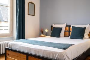 Posteľ alebo postele v izbe v ubytovaní Mon Appart'hôtel - Gare de Limoges - Appartement familial - Parking en supp