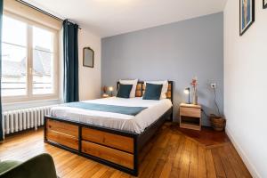 Posteľ alebo postele v izbe v ubytovaní Mon Appart'hôtel - Gare de Limoges - Appartement familial - Parking en supp