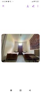 a living room with a couch and a table at Eka,s hotel in ortachala in Tbilisi City