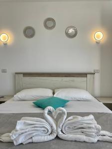 En eller flere senge i et værelse på Vila Cochilia Costinesti