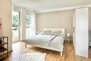 Postel nebo postele na pokoji v ubytování Modernes Studio beim Domplatz