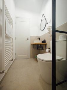 a bathroom with a white tub and a sink at Casa Gherman Cheia in Cheia