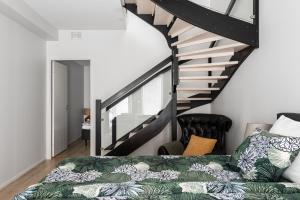 Ένα ή περισσότερα κρεβάτια σε δωμάτιο στο Borg Loft City Central