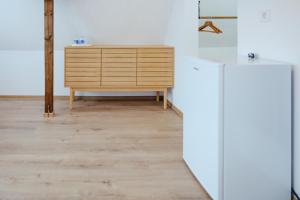 a wooden cabinet in a room with a wooden floor at Casa Gherman Cheia in Cheia +31 photos