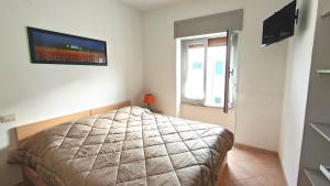 TV a/nebo společenská místnost v ubytování Casa Coralli Centro Storico + 47 fotografií