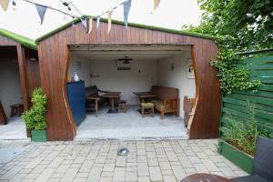 a garage with a table and chairs in it at The Orchard House in Kilkenny