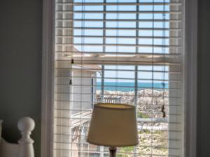 a room with a window with a view of the ocean at Skippers Hideout in North Topsail Beach