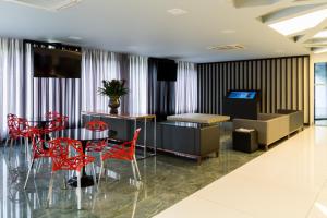 Uma área de estar em Hotel WZ Jardins