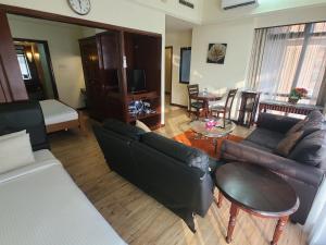 Posezení v ubytování KL Time Square Hotal Sarvice Suite