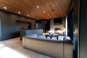 a living room with a couch and a table at Villa Blackwood in Söderkulla
