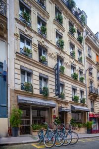 a group of bikes parked in front of a building at Hôtel Vendome Saint-Germain in Paris