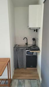 Køkken eller tekøkken på studio avec extérieur