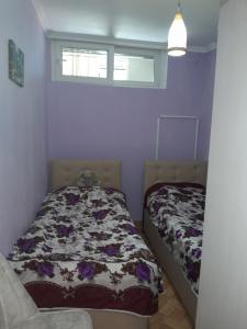 a bedroom with two beds and a window at Black Sea in K'obulet'i
