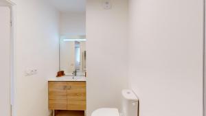 a bathroom with a toilet and a sink and a mirror at Sweetly Versailles St Cyr l'école in Saint-Cyr-lʼÉcole +12 photos