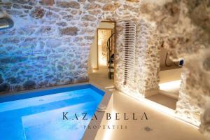 a room with a swimming pool in a building at KAZA BELLA - Haut Marais Modern flat with small pool in Paris +12 photos
