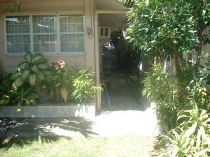 a front door of a house with plants at Mactan Cebu House in Cebu City +8 photos