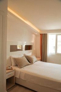 Postel nebo postele na pokoji v ubytování Doc's Hotel Kemer