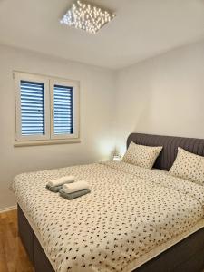 Postel nebo postele na pokoji v ubytování Apartman Beach Makarska
