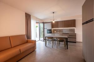 a living room with a couch and a table at Residence Paradise in Riva del Garda